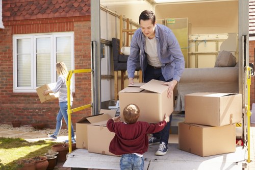 Furniture removals team handling a sofa move in Bethnal Green