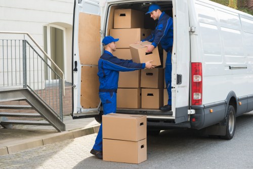 Moving team loading household furniture for a Bethnal Green home move