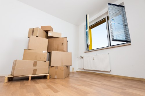 Worker checking and securing loaded items in a van