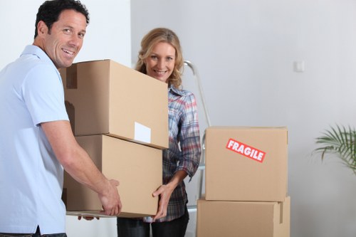 Commercial moving crew handling office furniture in East London